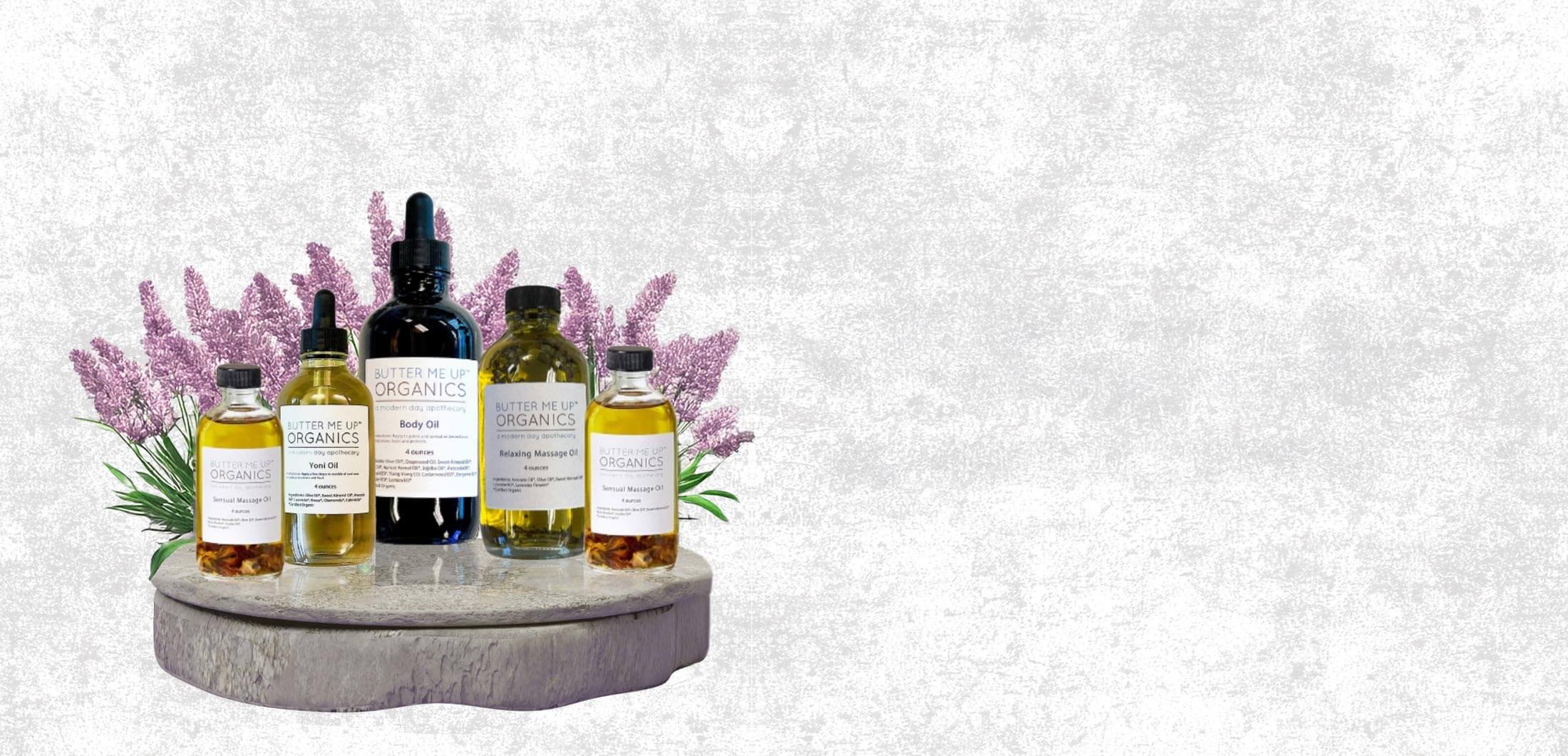 Collection of skincare bottles on a decorative stand with lavender flowers against a light gray background